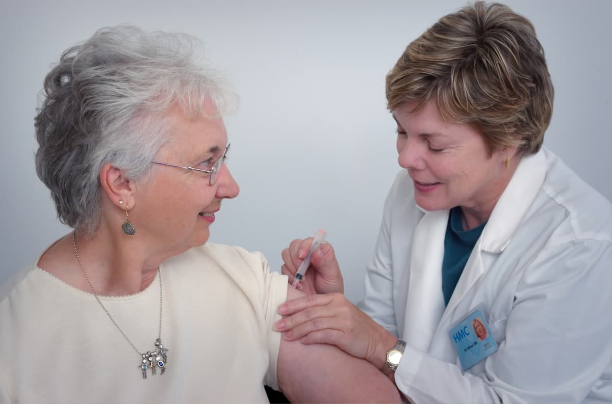 Nurse providing attentive in-home medical support